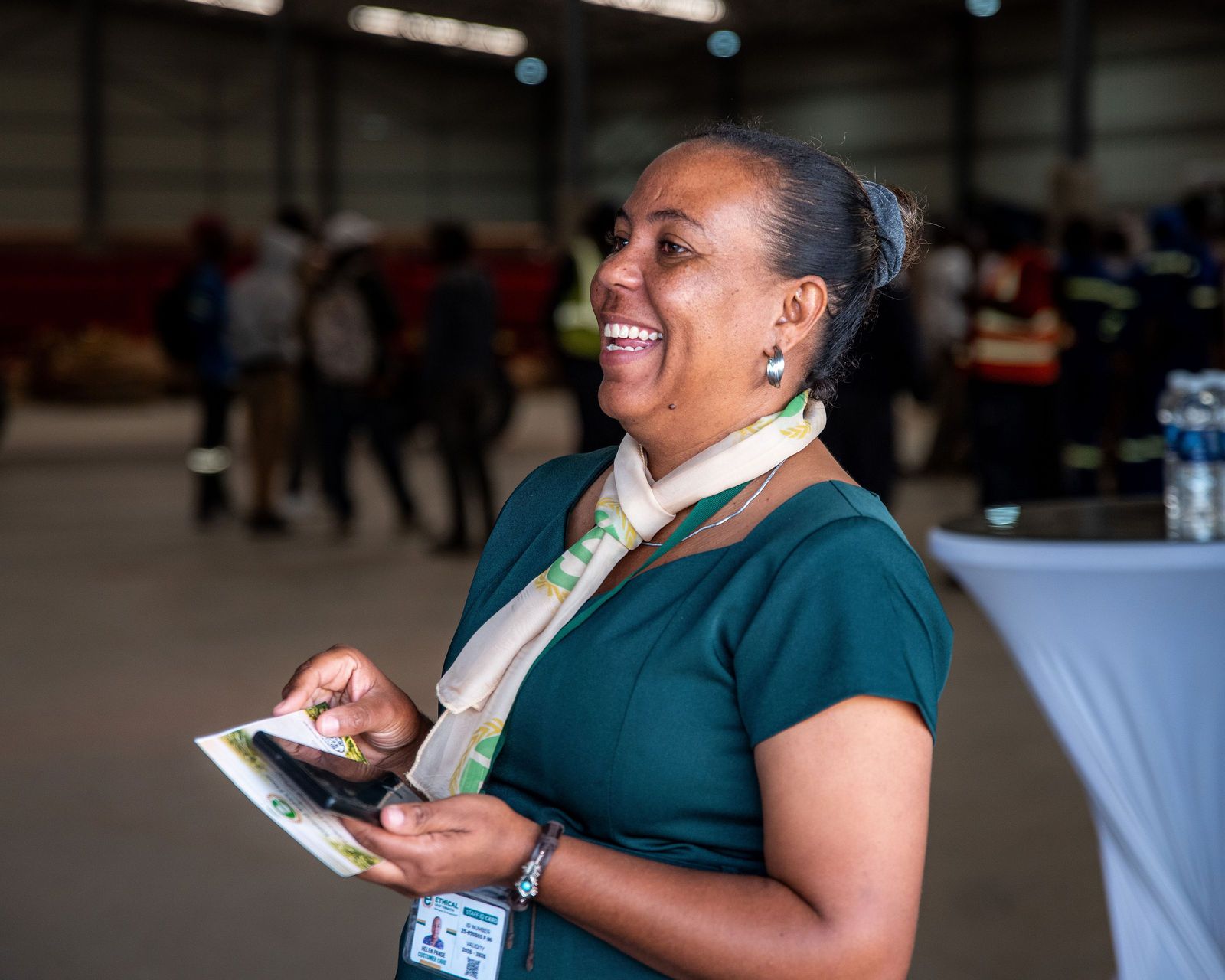 A smiling customer care team member on the sales floor