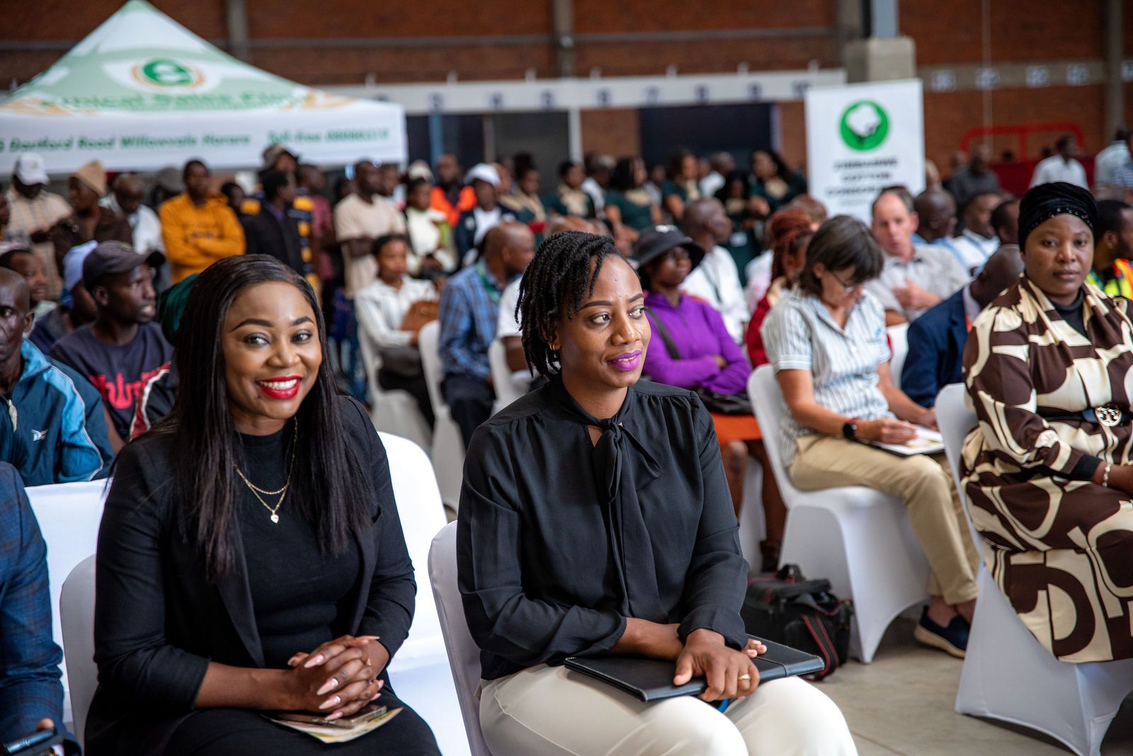 A seated crowd fills the Ethical Sales Floor during an event